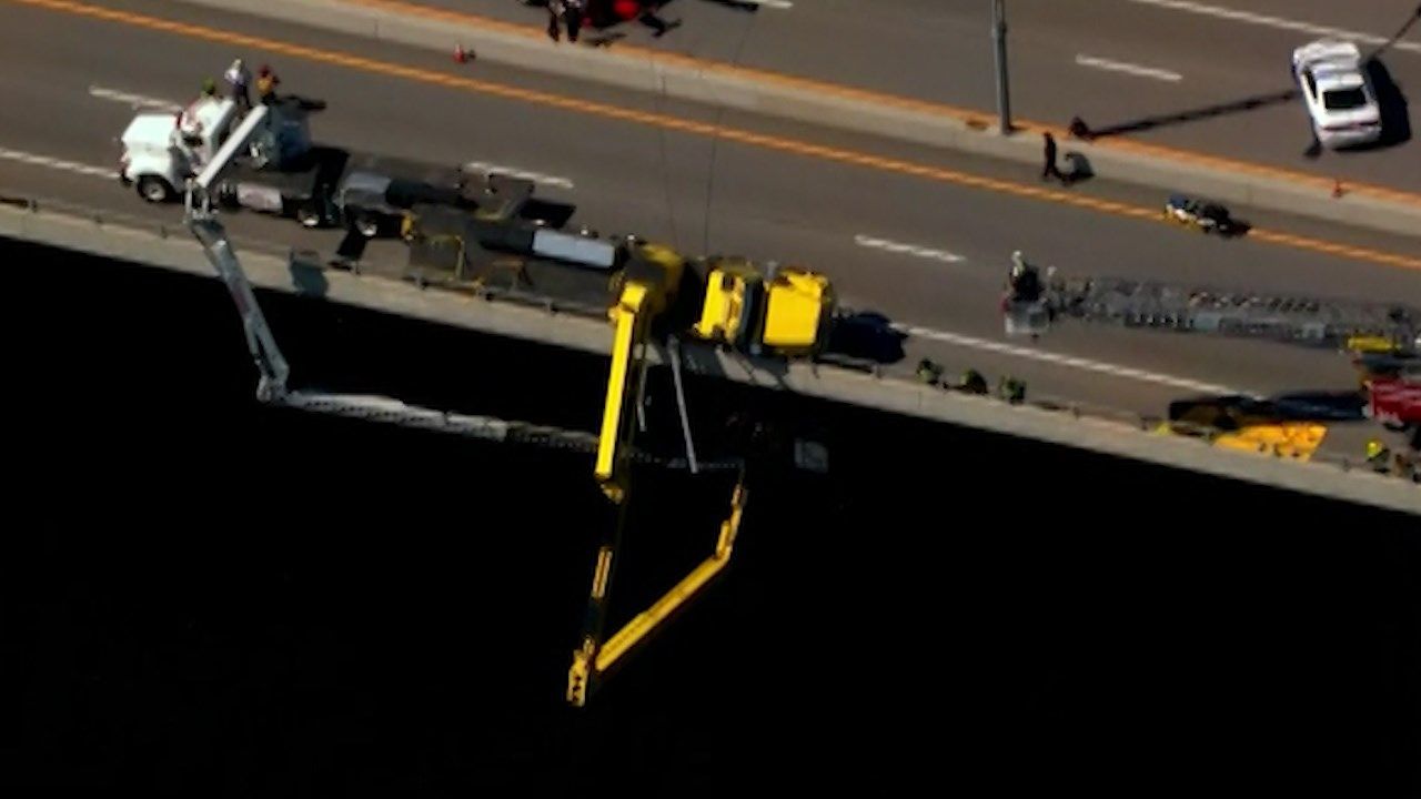 2 workers rescued from bucket under bridge after truck tips ABC6